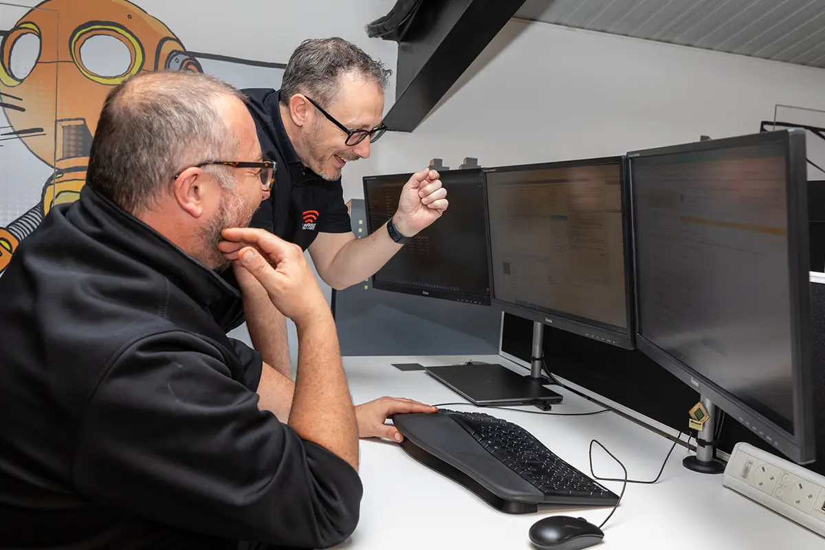 Sunrise employees working on a computer